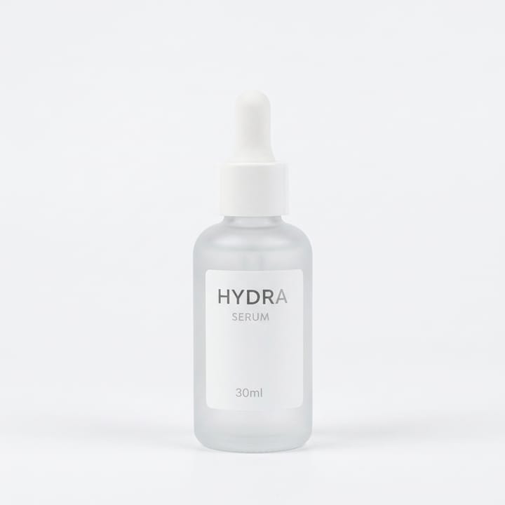 AI Photo Studio result: frosted glass dropper serum bottle against a light gray seamless background